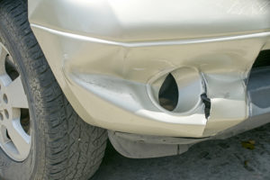 A Dent On The Right Front Of A Pickup Truck (damage From Crash)