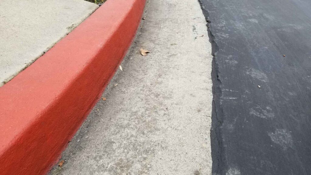 Tripped and Fell on an Unmarked Curb in Front of a Store