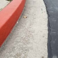Tripped and Fell on an Unmarked Curb in Front of a Store Tripped and Fell on an Unmarked Curb in Front of a Store