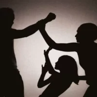 A Mother Protects Her Child from Father Violence