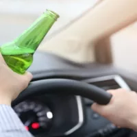 Men Are Drinking Beer with Alcohol While Driving