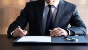 Lawyer at Desk Signing Document