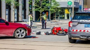 Motorcycle Was Hit by a Car on the Street During a Summer Day