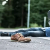 Male person got hit by a car while crossing the pedestrian