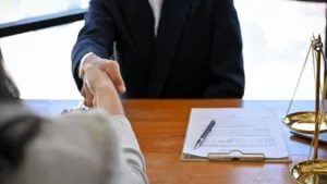 A Lawyer in a Meeting with His Client in the Office of a Law Firm