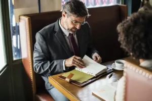Lawyer at a desk reviewing notes about client case